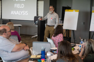Man presenting in a meeting room.